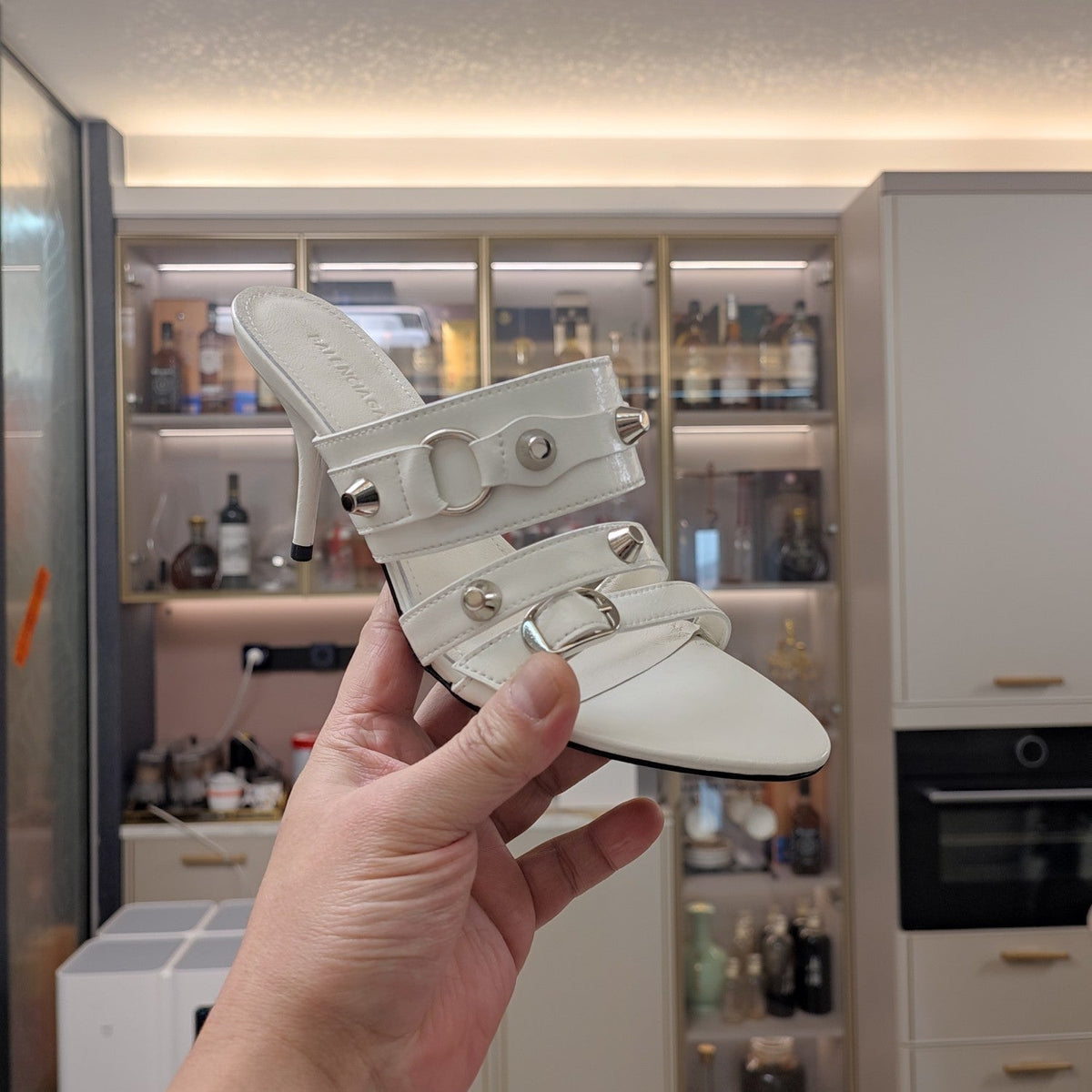 STRAPPY HIGH-HEELED SANDALS IN WHITE STUDDED WAX-OIL SHEEPSKIN
