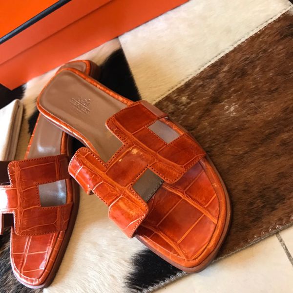 HERM Oran Slide Sandals In Orange Shiny Niloticus Crocodile Skin