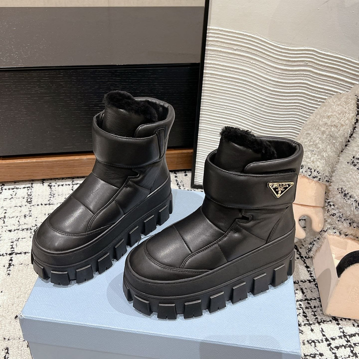 MONOLITH ANKLE BOOTS WITH STRAP IN BLACK CALFSKIN AND FLEECE LINING