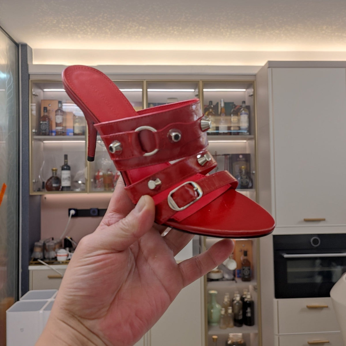STRAPPY HIGH-HEELED SANDALS IN RED STUDDED WAX-OIL SHEEPSKIN